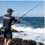 Okuma Azores Blue popping rod used from a rocky saltwater shore