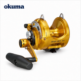 Okuma Makaira II gold overhead trolling reel on white background
