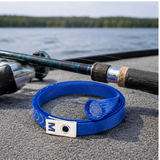 Blue rod sleeve protecting a fishing rod near the water
